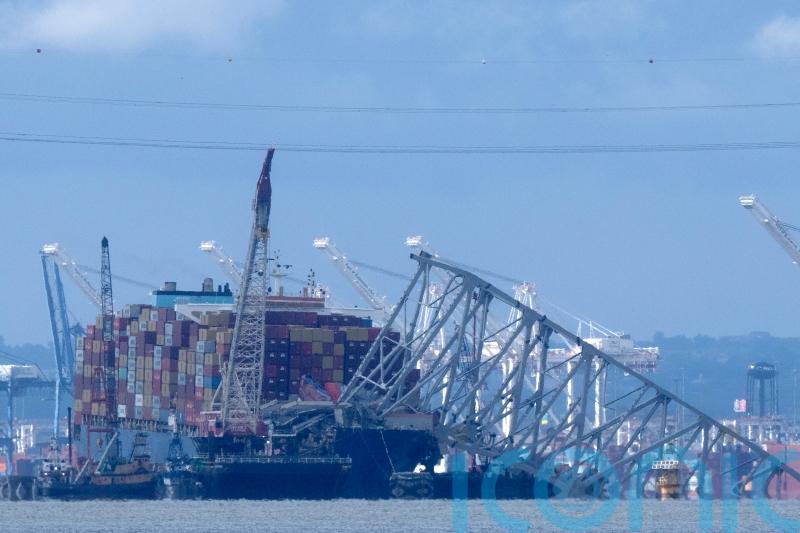 Crews conduct controlled demolition of Baltimore bridge span