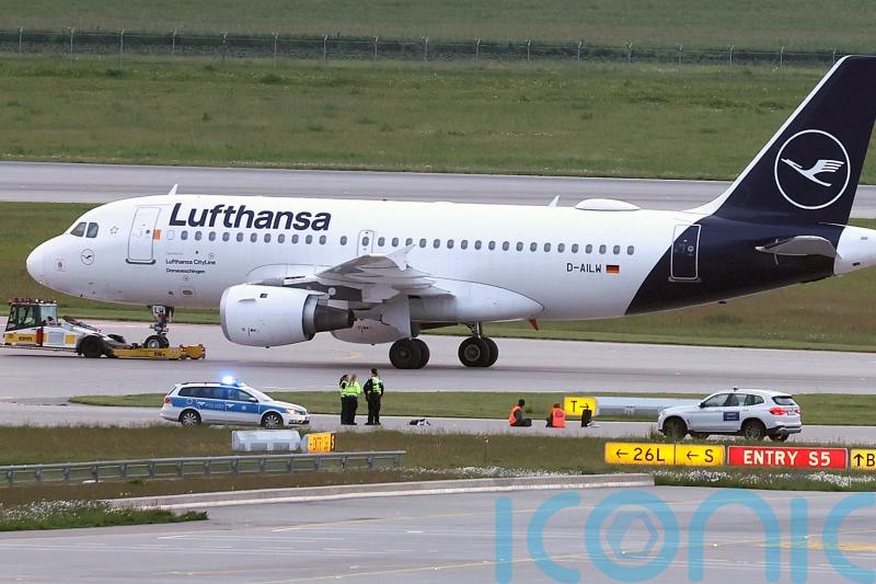 Climate protesters close Munich Airport after gluing themselves to runway