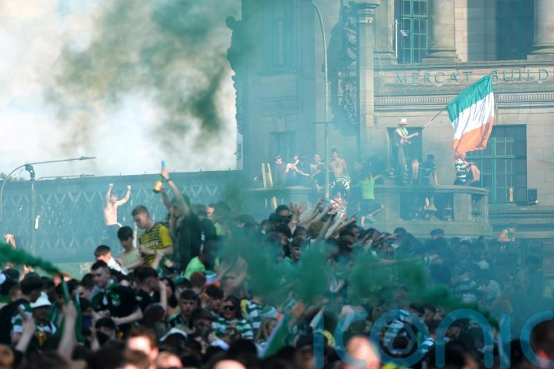 Celtic fans turn city centre green and white during trophy celebrations