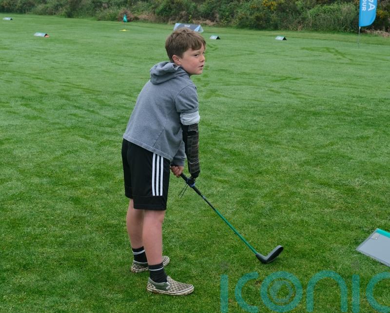 Boy with limb difference ‘excited’ to play golf with grandfather thanks to tool