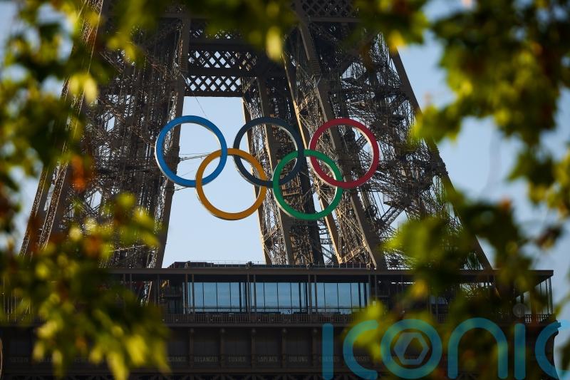 Paris organisers unveil five Olympic rings mounted on Eiffel Tower