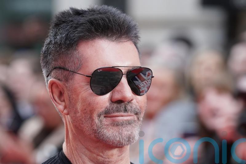 Simon Cowell says becoming a father saved his life after death of parents