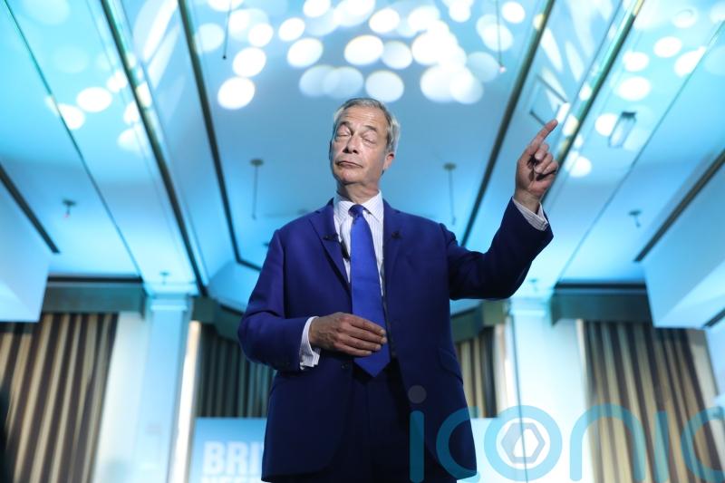 Nigel Farage sings along to Eminem on stage in Blackpool