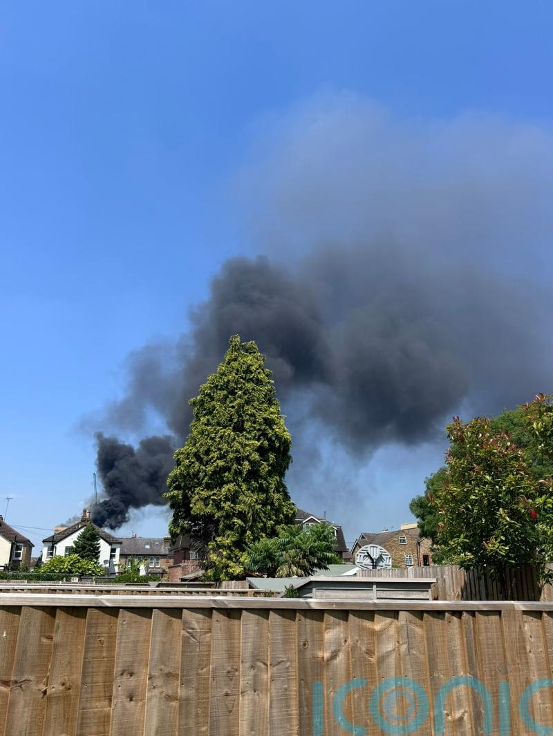 Large fire breaks out at tower block in Surrey town centre