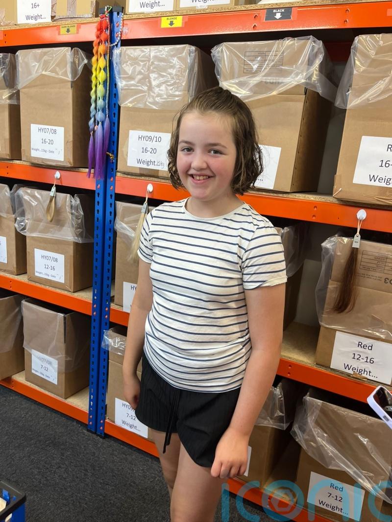 Girl who cut off 13 inches of hair to make cancer wig eyes world record