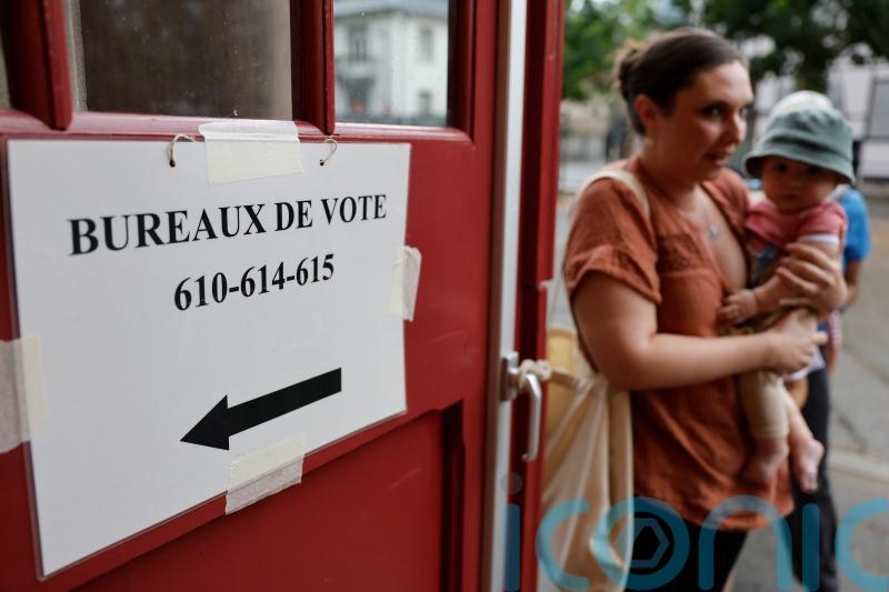 Far right leads in polls as voting begins in France’s parliamentary election