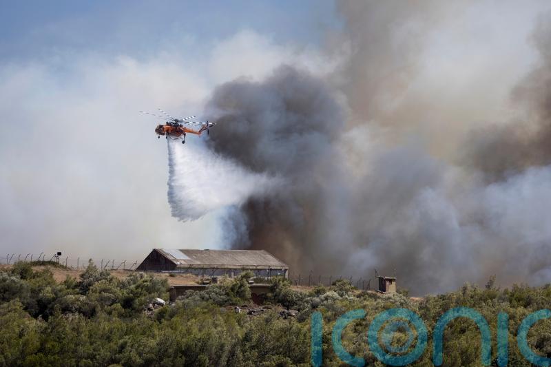 Firefighters tackle blazes on Greek islands of Chios and Kos