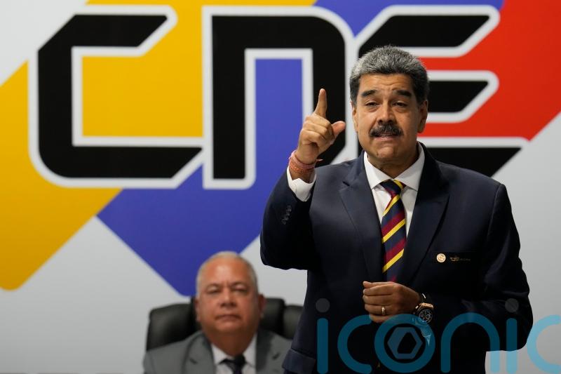 Venezuela’s president says he is resuming negotiations to lift sanctions