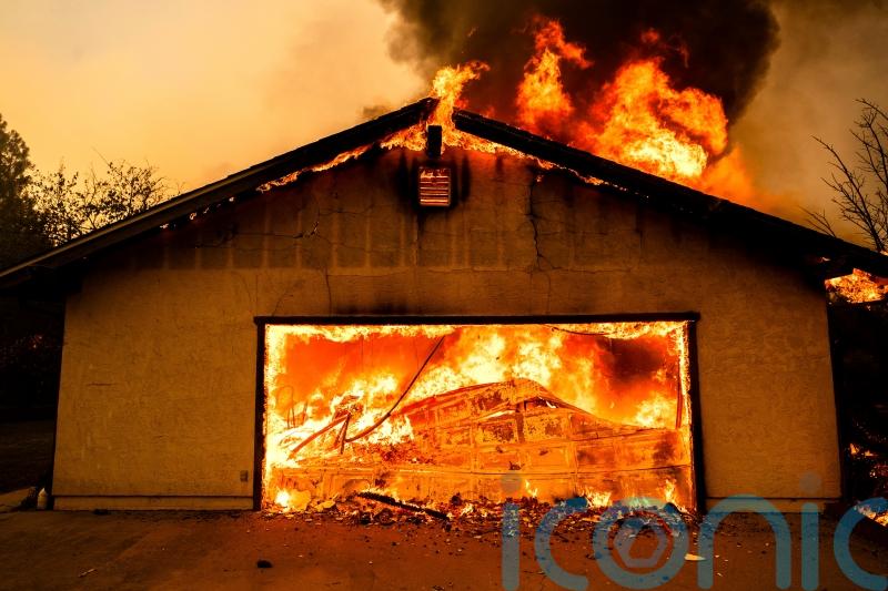 Northern California wildfire spreads, with more hot weather expected