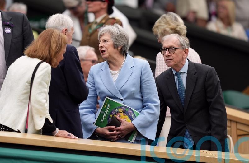 Theresa May and Romeo Beckham among spectators on drizzly day three of Wimbledon