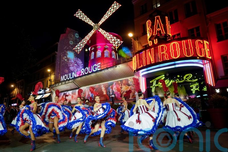 Moulin Rouge restores windmills after collapse