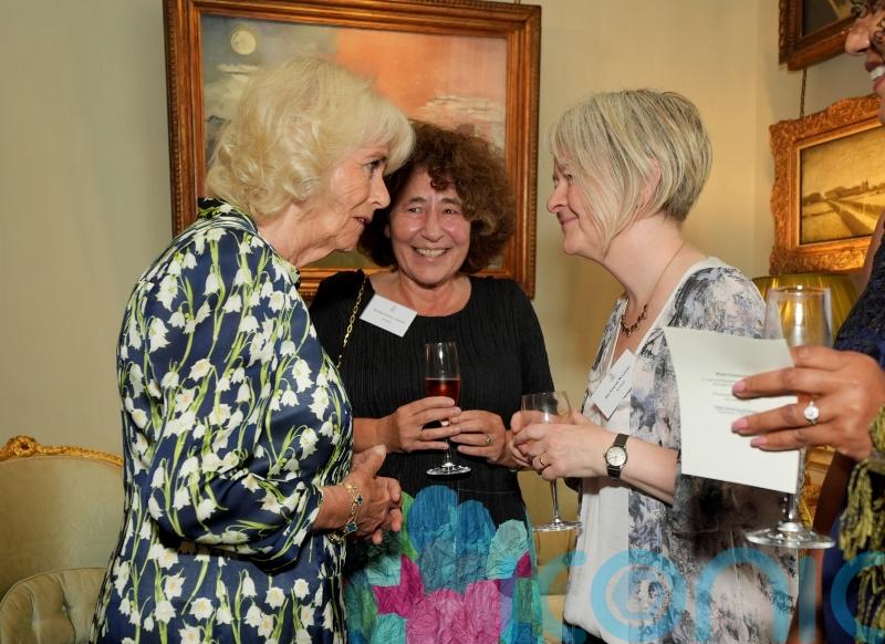 Queen and author share joke about weather-app ‘obsession’