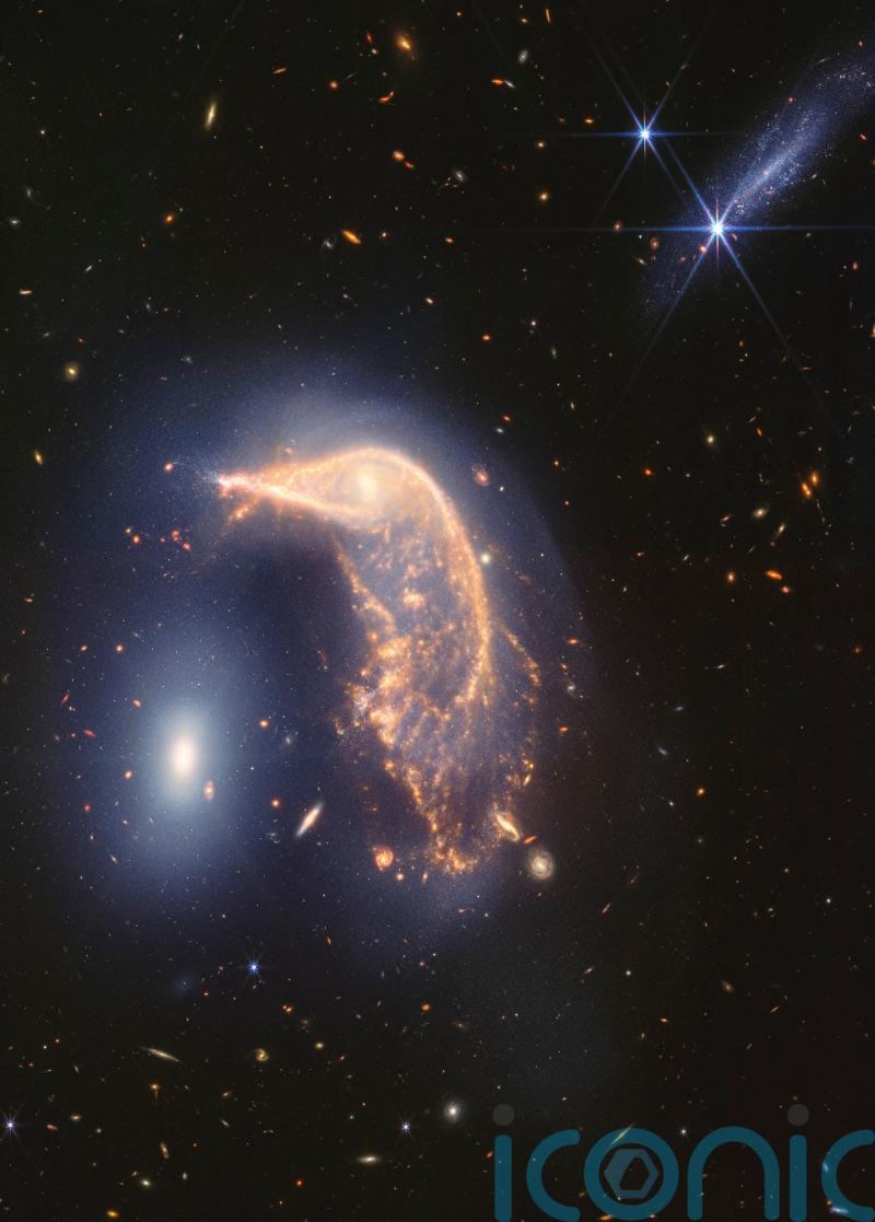 Webb Space Telescope’s cosmic shot shows intertwined galaxies glowing infrared