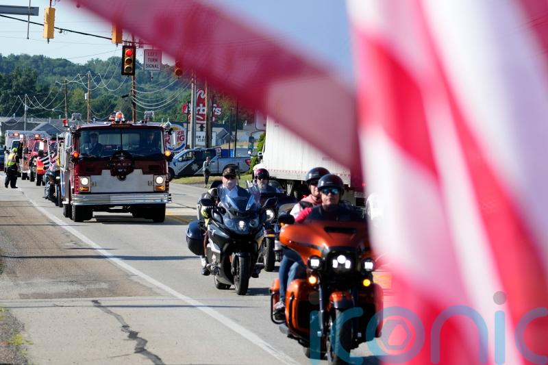 Hundreds gather for funeral of former fire chief killed in Trump rally shooting
