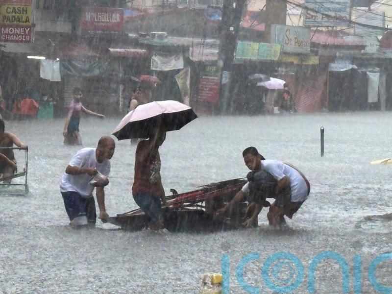 Taiwan prepares for strong typhoon as monsoon rains kill 13 in the Philippines