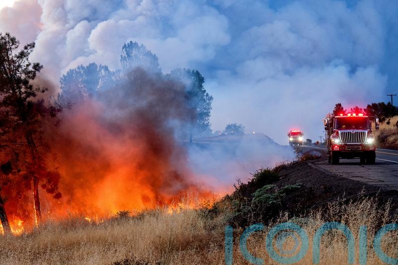 Man arrested over California fire sparked by burning car pushed into gully