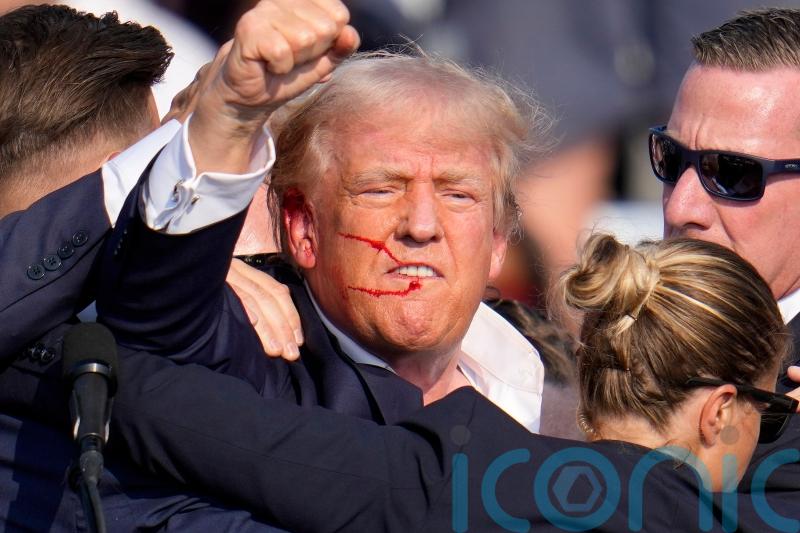 Trump struck by bullet during assassination attempt, FBI says