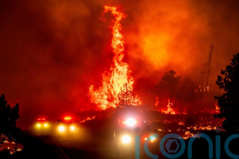 California’s largest wildfire explodes in size as fires rage across US west