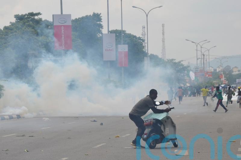 Nigerian leader demands end to protests over hardship which have turned violent
