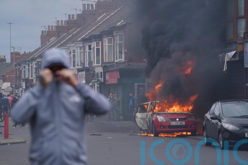 Police steeled for further violence as more than 140 charged over riots