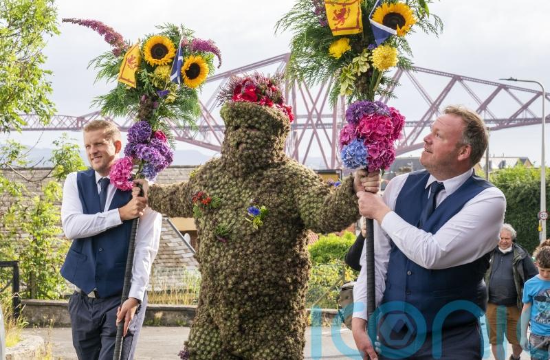 Locals turn out to celebrate annual tradition of the Burryman parade