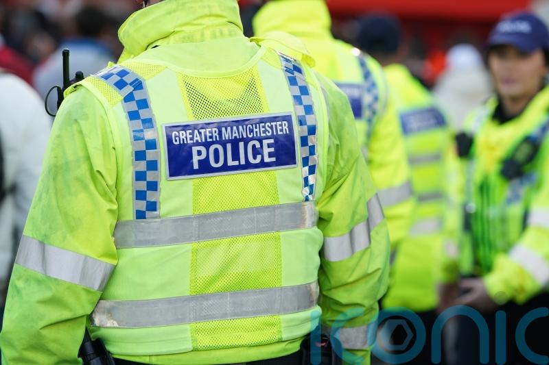 Two people arrested on suspicion of murder after man falls from Salford balcony