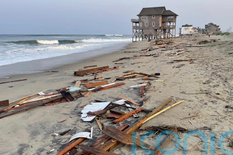 Storm Ernesto gains strength as a hurricane over open Atlantic