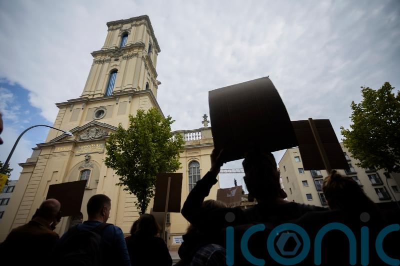 Protests as German president inaugurates rebuilt tower of church with Nazi links