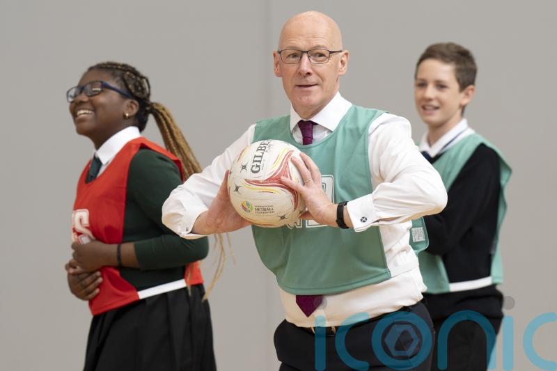 Swinney joins netball match to mark two decades of Active Schools programme