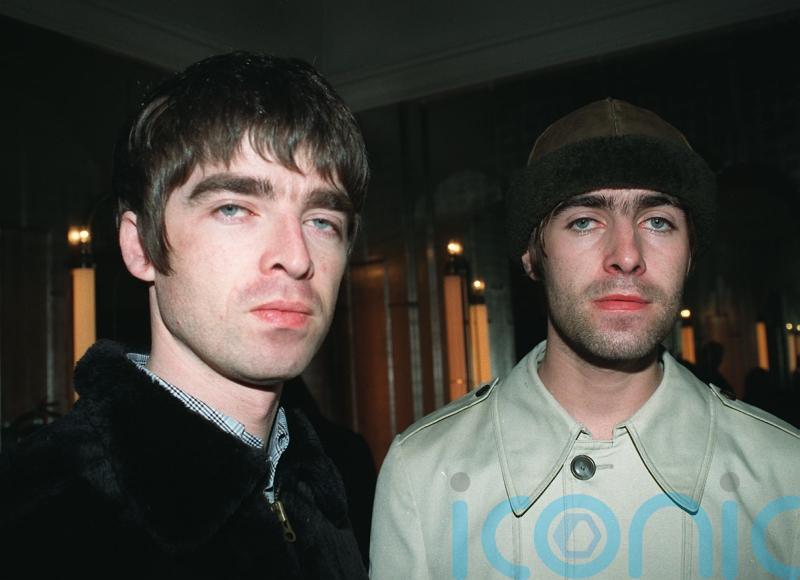 Oasis top album charts for first time in 14 years amid reunion ticket furore