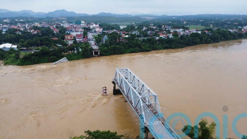 Bridge collapses as more rain falls in Vietnam, raising storm death toll to 21
