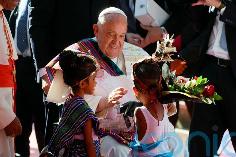 Crowds flock to Pope Francis’ seaside mass in East Timor