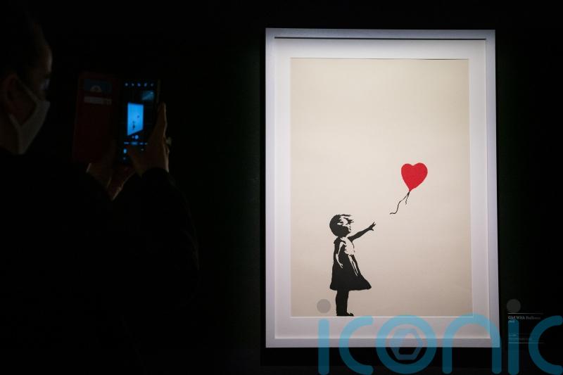 Two charged with burglary after Banksy painting stolen from London gallery
