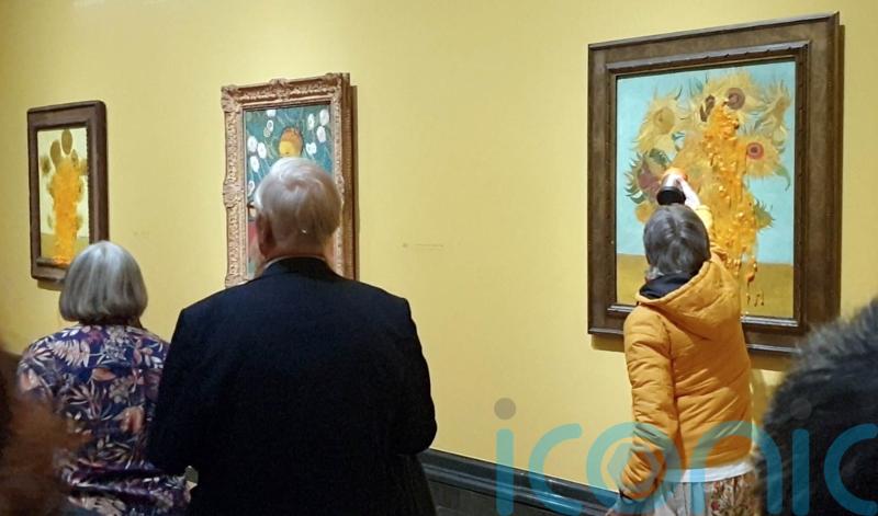 Eco-activists pour soup over Van Gogh paintings again hours after others jailed