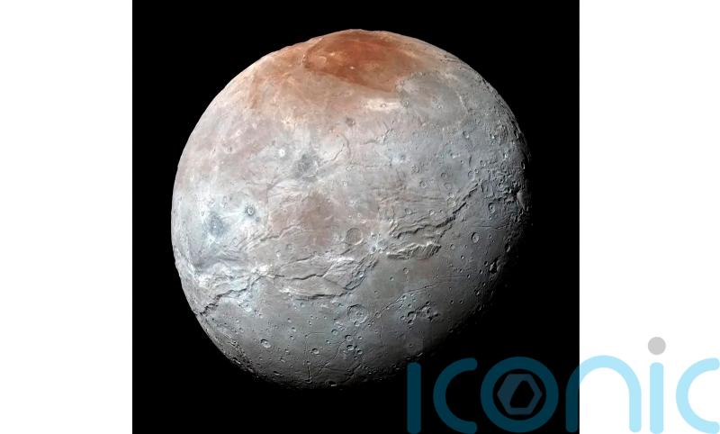 Nasa detects traces of carbon dioxide on surface of Pluto’s largest moon