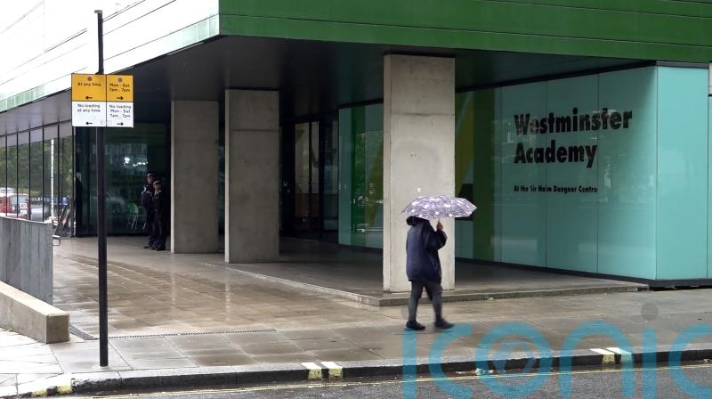 Man arrested following suspected acid attack outside school