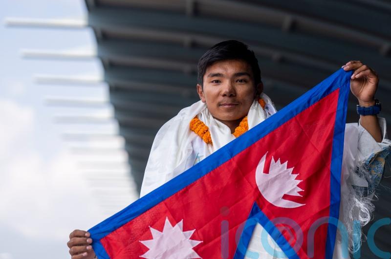 Record-setting teenage climber returns to hero’s welcome in Nepal