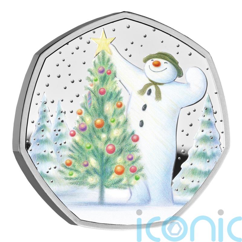 Gold Snowman coin hidden in advent calendar for someone to find on Christmas Eve