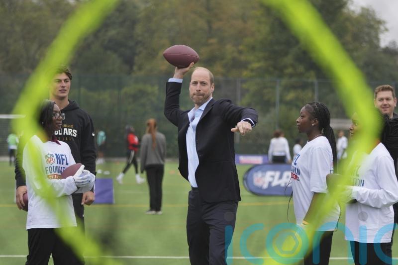 William shows off &lsquo;unbelievable arm&rsquo; playing American football with youngsters
