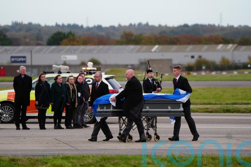 Alex Salmond’s body met by family and piper as plane lands in Aberdeen