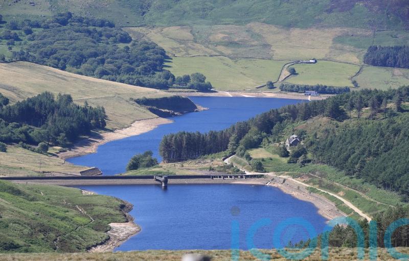 Divers search overnight for man who went into reservoir