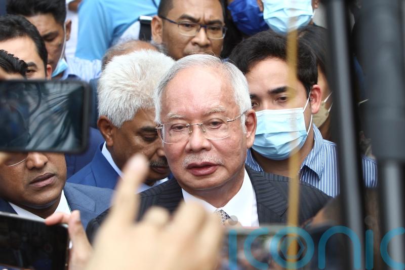 Former Malaysian PM apologises for embezzlement scandal and reiterates innocence