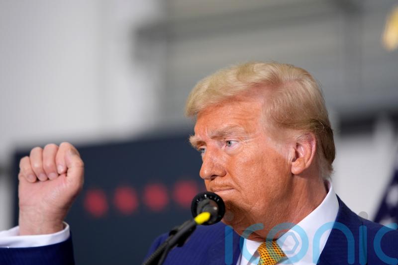 Ex-model says Trump groped her while Epstein watched