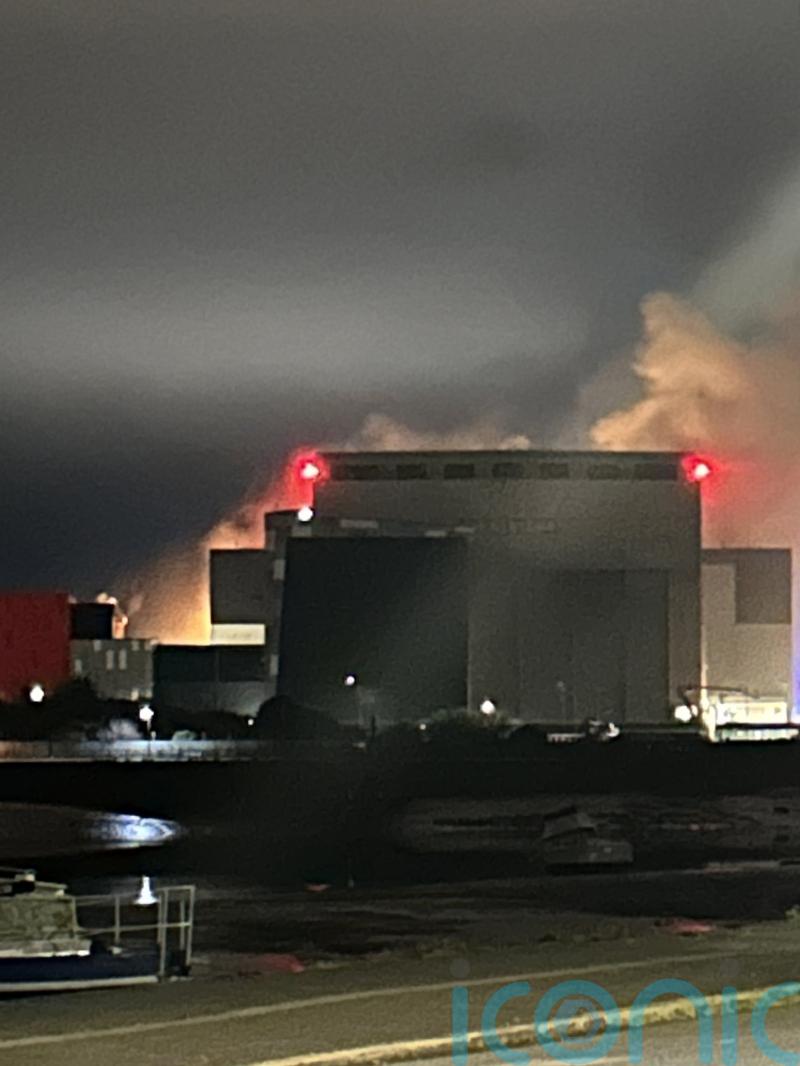 Thick smoke and bright flashes seen during fire at nuclear submarine shipyard