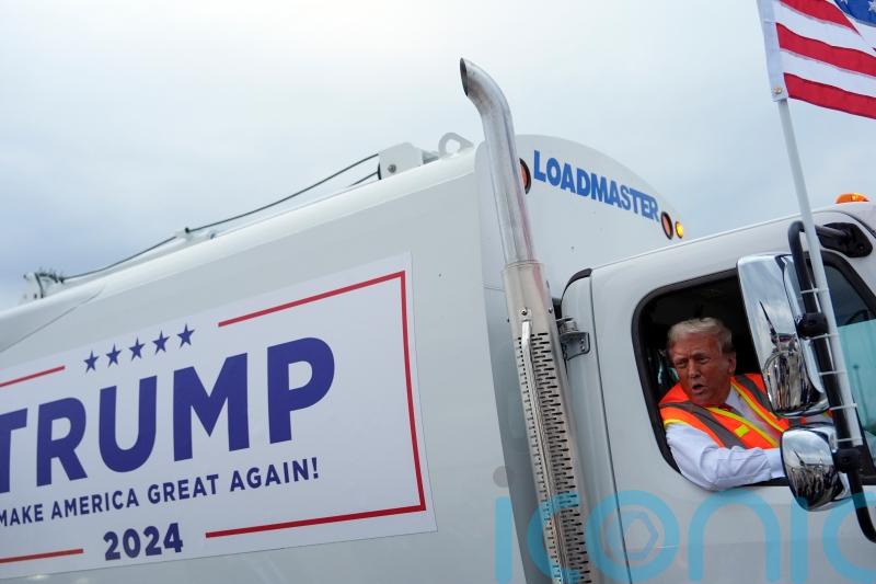 Trump boards garbage truck to highlight Biden remark