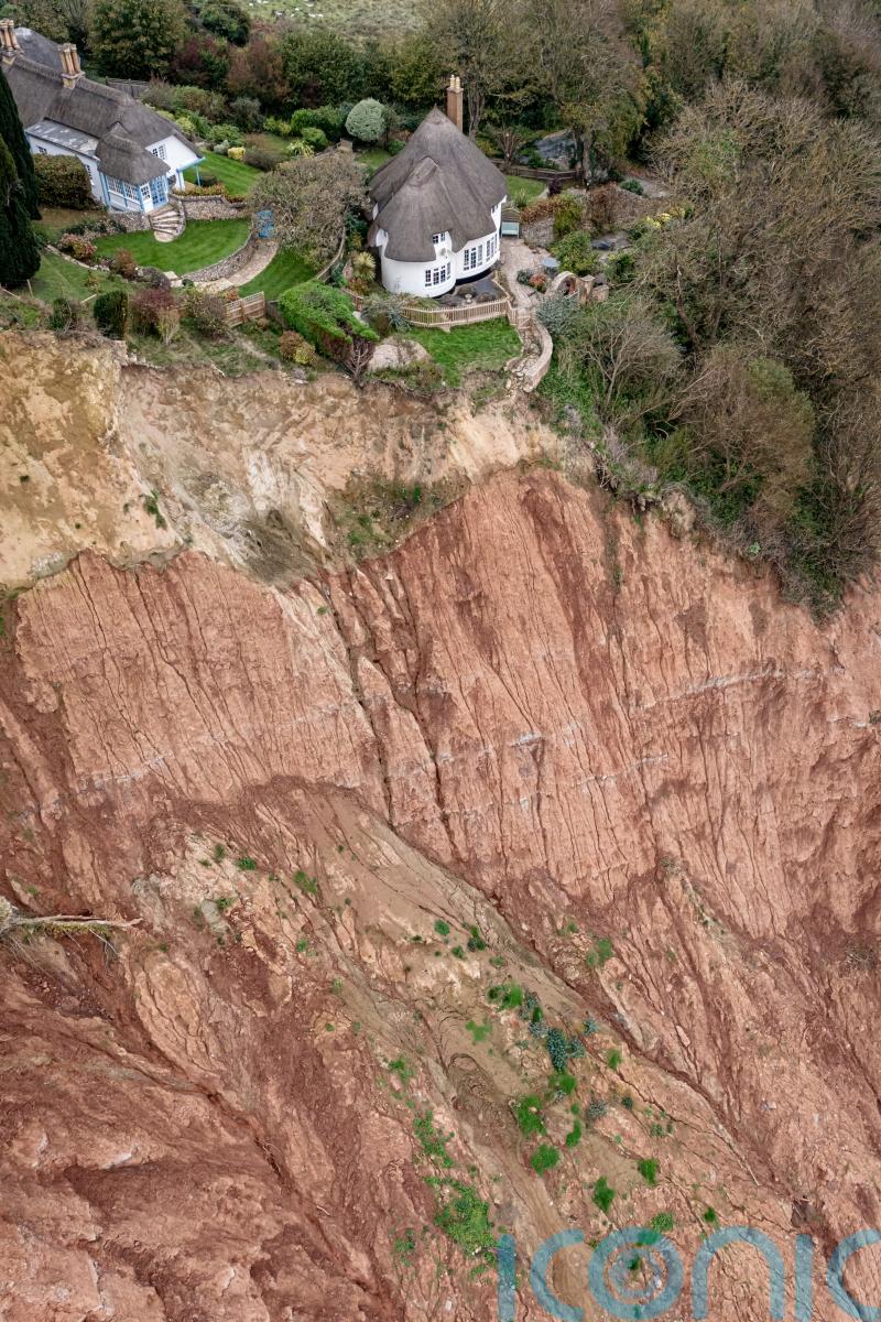 Cottage left teetering on cliff edge following massive landslip