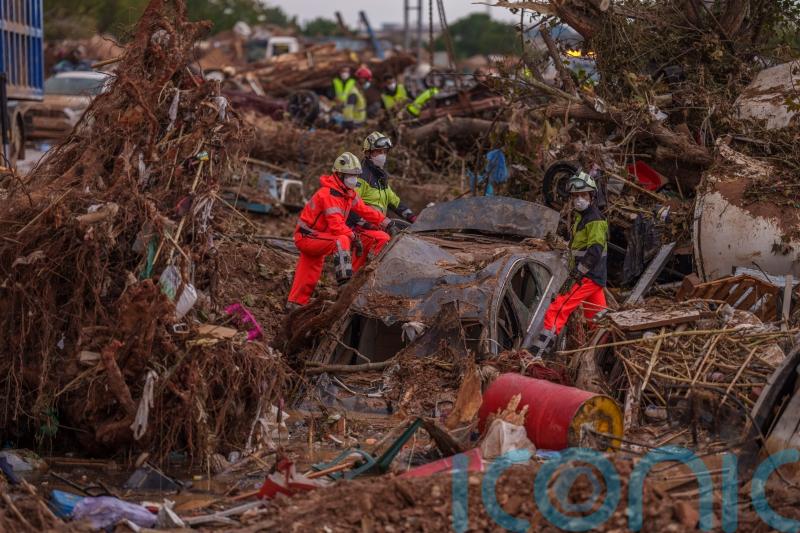 Rains in Barcelona disrupt rail as troops search for flood victims in Valencia