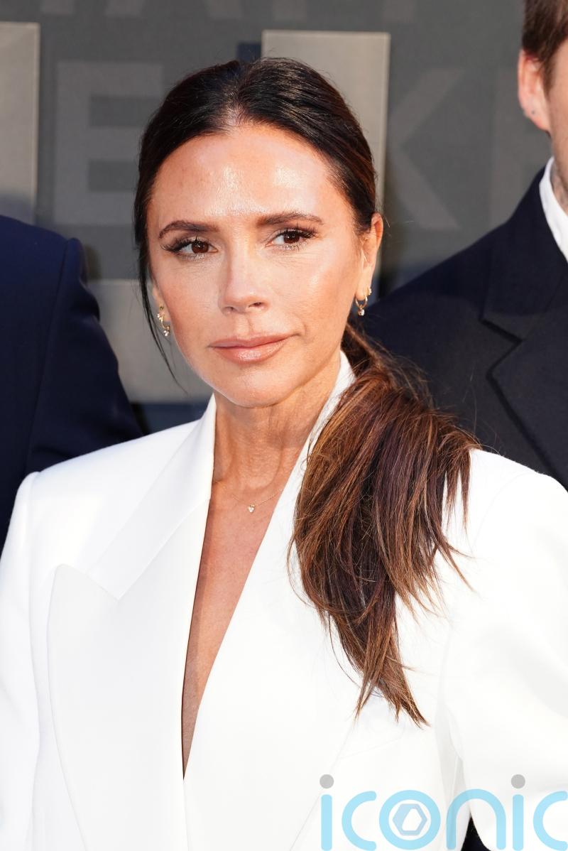 Victoria Beckham given a women of the year prize by daughter Harper