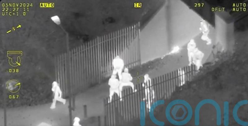 Aerial footage of Bonfire Night disorder shows yobs hurling objects at police