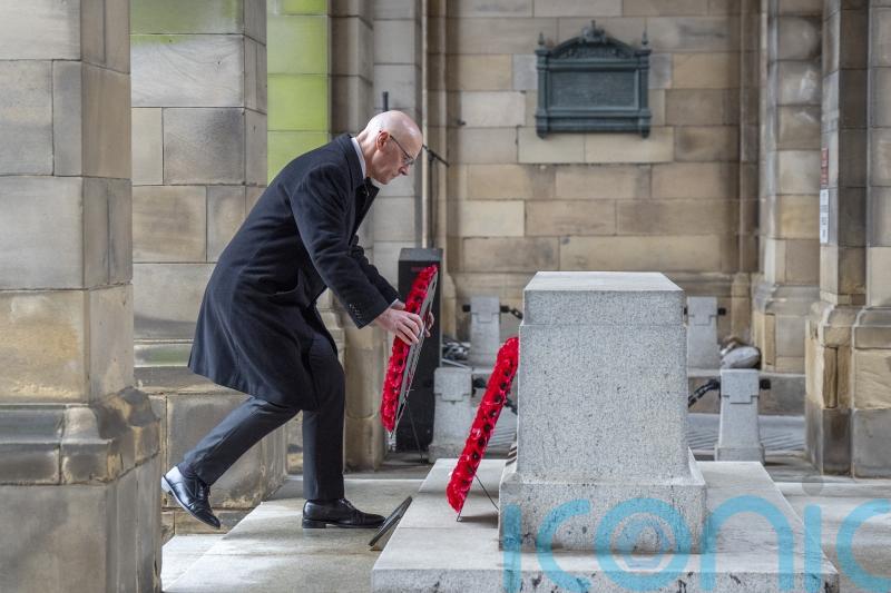 Swinney pays tribute to war hero uncle as nation pauses on Remembrance Sunday